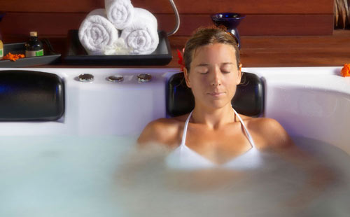 Woman relaxing in an Arctic Spa with Onzen feature